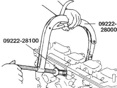 2. Using the special tool, compress the valve spring and remove the valve…
