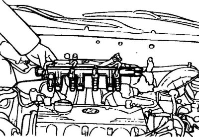 Fig. 2.202. Removing the fuel manifold…